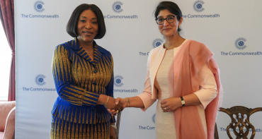 Commonwealth Secretary-General and UNOOSA Director shake hands after signing the MoU