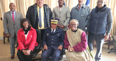 8 people standing for a group pic