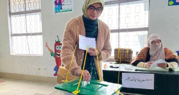 woman casting vote in Pakistan election