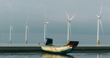 Solar panel in local area with fishing boat