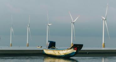 Solar panel in local area with fishing boat