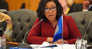 Commonwealth Secretary-General speaking into microphone at the Commonwealth Trade Ministers Meeting