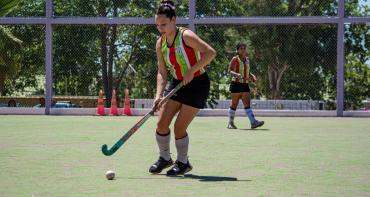 Woman playing Hockey Sport