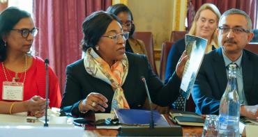 Hon Shirley Botchwey holding a report at the Commonwealth Forum of Sustainable Sovereign Debt