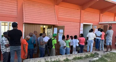 Citizens wait to cast their vote in the 2026 Antigua and Barbuda elections