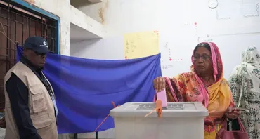 H.E. Nana Akufo-Addo, former President of the Republic of Ghana watches as a woman makes her vote during the Bangladesh 2026 parliamentary elections