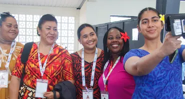 A group of young people taking a selfie at the 2024 Commonwealth Youth Forum in Samoa