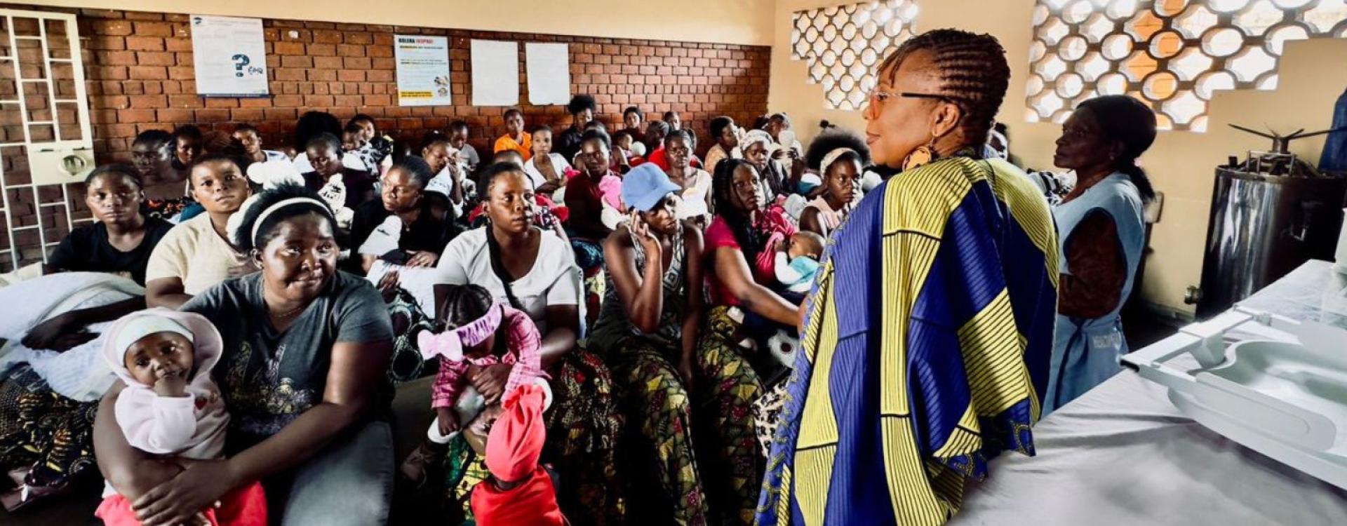 Karen Nakawala presenting to meeting of women to help prevent cervical cancer